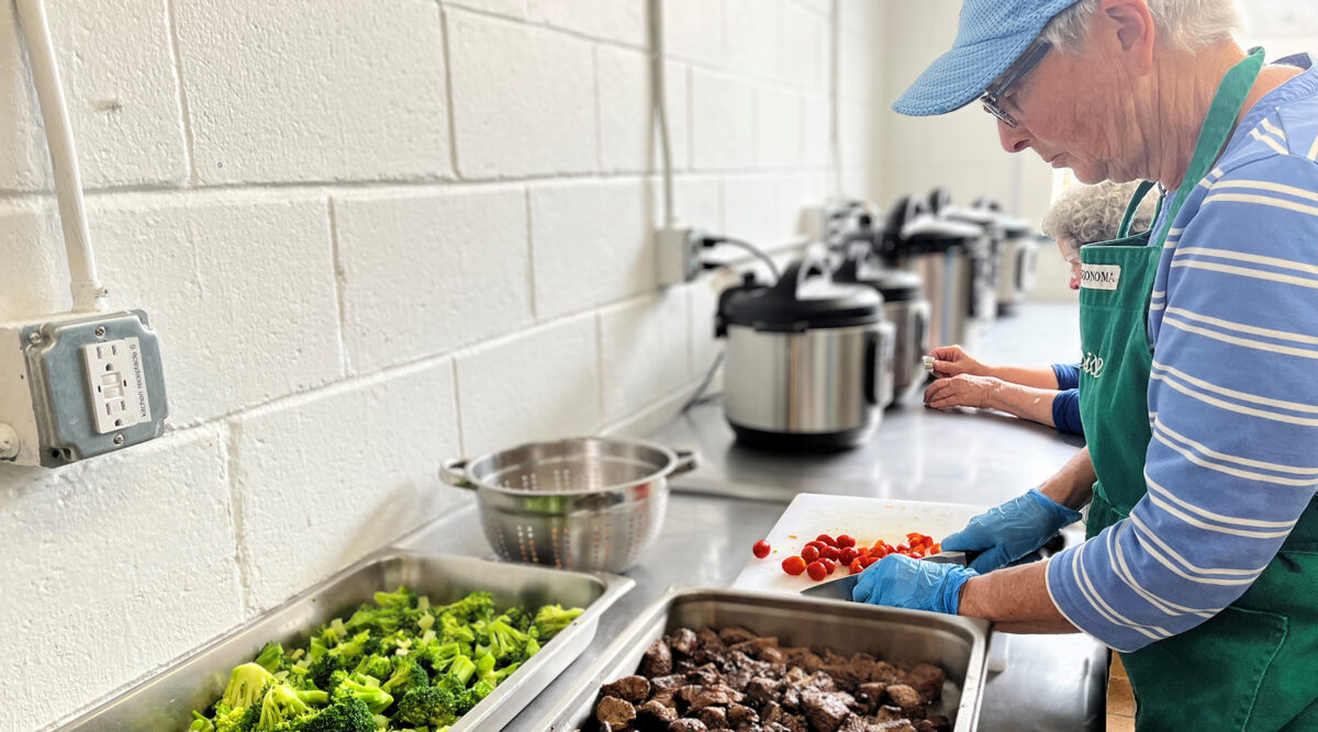 Man preparing food at the sink