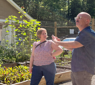 Two people in front of garden at Stonewood Farm