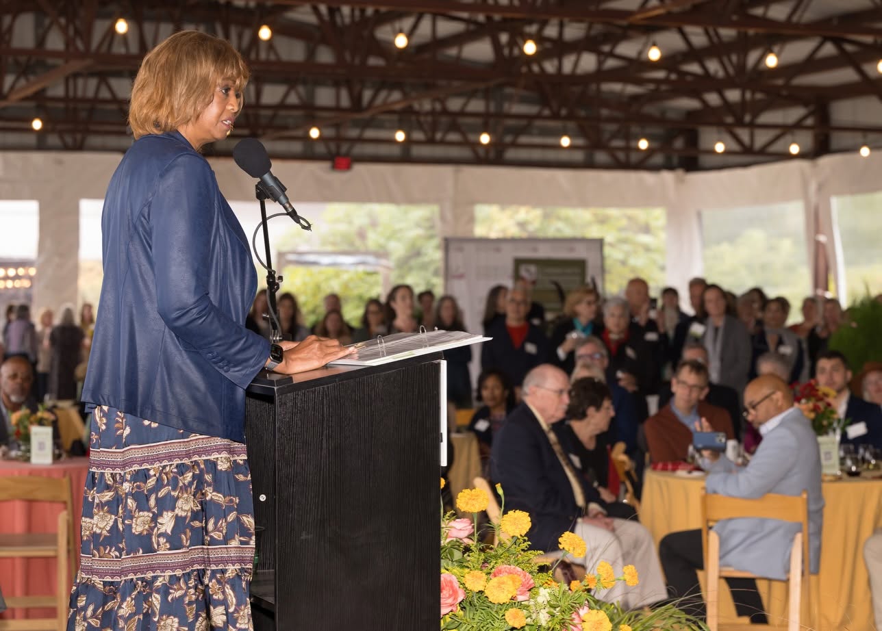 person standing at event podium